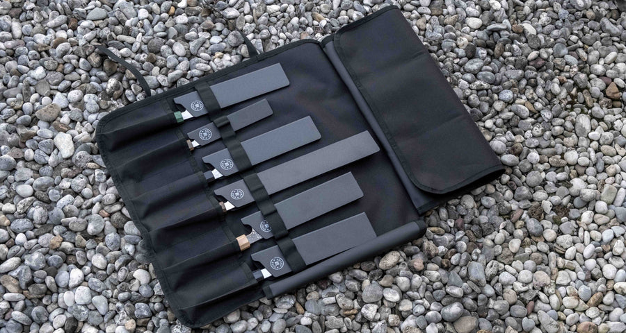 Our SharpEdge Black Chef's Knife Roll is best suited for chefs on-the-go and home cooks who need a sturdy knife roll that can hold very long knives (up to 440mm (17.3")). It has 6 pockets for knives and utensils, and additional velcro fasteners to keep them in place. A minimalistic, durable black knife bag. Get yours.