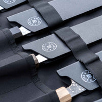 Our SharpEdge Black Chef's Knife Roll is best suited for chefs on-the-go and home cooks who need a sturdy knife roll that can hold very long knives (up to 440mm (17.3")). It has 6 pockets for knives and utensils, and additional velcro fasteners to keep them in place. A minimalistic, durable black knife bag. Get yours.