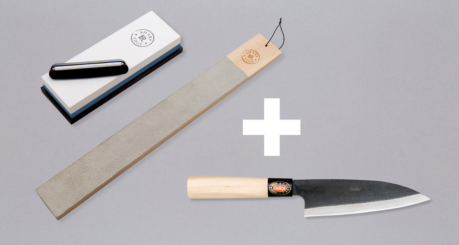 sharpening set: whetstone with angle guide, leather strop and santoku knife