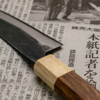 This Ajikiri SUJ-2 blade made by Yoshida Hamono is a Japanese knife for small fish. It's fitted with an octagonal rosewood handle which is topped with a cedar ferrule. The blade is forged from SUJ-2 steel with a hardness is 63-64 HRC, which holds its edge for a long time and is very easy to resharpen.