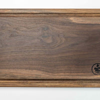These face grain cutting boards are handcrafted by local Slovenian woodworker J. Gros. They are made from American walnut (Juglans nigra), known for its strength, durability and color. This small steak cutting board fits on any countertop. Due to its striking surface, it can double as a serving or presentation board.