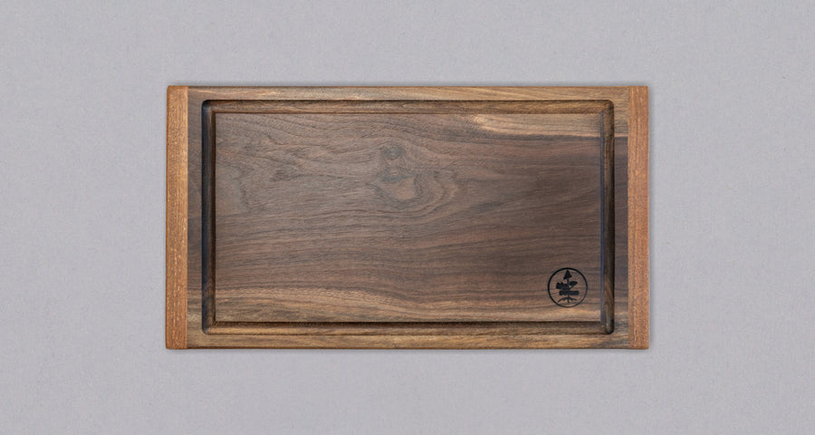 These face grain cutting boards are handcrafted by local Slovenian woodworker J. Gros. They are made from American walnut (Juglans nigra), known for its strength, durability and color. This small steak cutting board fits on any countertop. Due to its striking surface, it can double as a serving or presentation board.