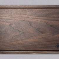 Handcrafted by Slovenian woodworker J. Gros, these cutting boards are made from American walnut, known for strength and durability. This extra large cutting board offers plenty of space for comfortable and lengthy chopping – either at home or in a professional kitchen. It also makes a great serving board.