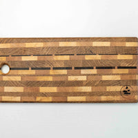 This handcrafted end grain cutting board is composed of various wood types. With the working surface of approximately 39x20cm (15.3" x 7.8") it is just the right size to fit onto any countertop, either at home or in a professional kitchen. End grain cutting boards are durable and help keep your knife sharper for longer.