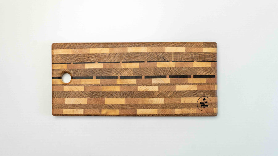 This handcrafted end grain cutting board is composed of various wood types. With the working surface of approximately 39x20cm (15.3" x 7.8") it is just the right size to fit onto any countertop, either at home or in a professional kitchen. End grain cutting boards are durable and help keep your knife sharper for longer.