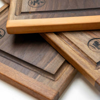 These face grain cutting boards are handcrafted by local Slovenian woodworker J. Gros. They are made from American walnut (Juglans nigra), known for its strength, durability and color. This small steak cutting board fits on any countertop. Due to its striking surface, it can double as a serving or presentation board.