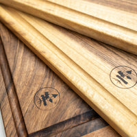 Handcrafted by Slovenian woodworker J. Gros, these cutting boards are made from walnut wood, known for strength and durability. This extra large cutting board offers plenty of space for comfortable and lengthy chopping – either at home or in a professional kitchen. It also makes a great presentation or serving board.