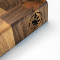 end grain walnut cutting board, handmade in Slovenia. Pictured: Logo on the side of the board.