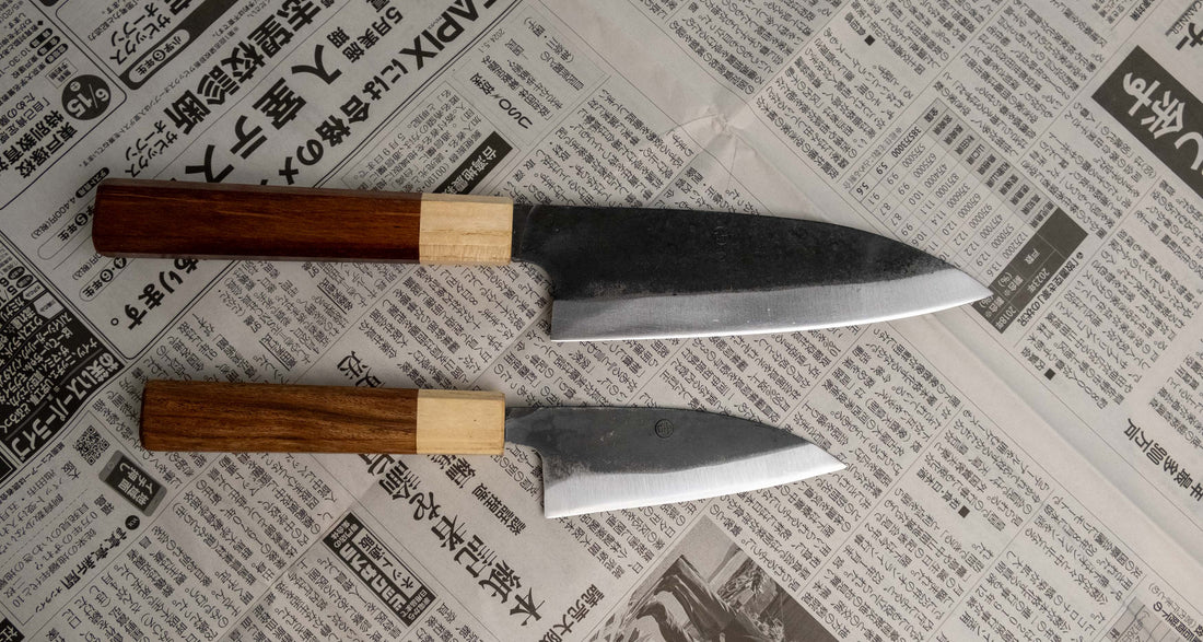 Meet your new favorite power couple - The Carbons. The set consists of Yoshida Ajikiri 100mm (3.9") and Yoshida Santoku Funayuki 155mm (6.1"). Small yet fierce, these two hand-forged knives are made from high-carbon SUJ-2 steel (63-64 HRC), known for its fine sharpness, long edge retention, and ease of sharpening. 