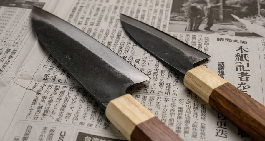 Meet your new favorite power couple - The Carbons. The set consists of Yoshida Ajikiri 100mm (3.9") and Yoshida Santoku Funayuki 155mm (6.1"). Small yet fierce, these two hand-forged knives are made from high-carbon SUJ-2 steel (63-64 HRC), known for its fine sharpness, long edge retention, and ease of sharpening. 