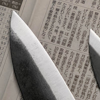 Meet your new favorite power couple - The Carbons. The set consists of Yoshida Ajikiri 100mm (3.9") and Yoshida Santoku Funayuki 155mm (6.1"). Small yet fierce, these two hand-forged knives are made from high-carbon SUJ-2 steel (63-64 HRC), known for its fine sharpness, long edge retention, and ease of sharpening. 