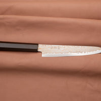 Hayabusa Petty Aogami #2 Rainbow Damascus 150mm is a versatile Japanese kitchen knife ideal for preparing meat, fish, and vegetables. Its blade, made of Aogami #2 steel, is thin and precise. It excels in sharpness, edge retention, and ease of maintenance, but above all looks - with the unique rainbow damascus pattern!