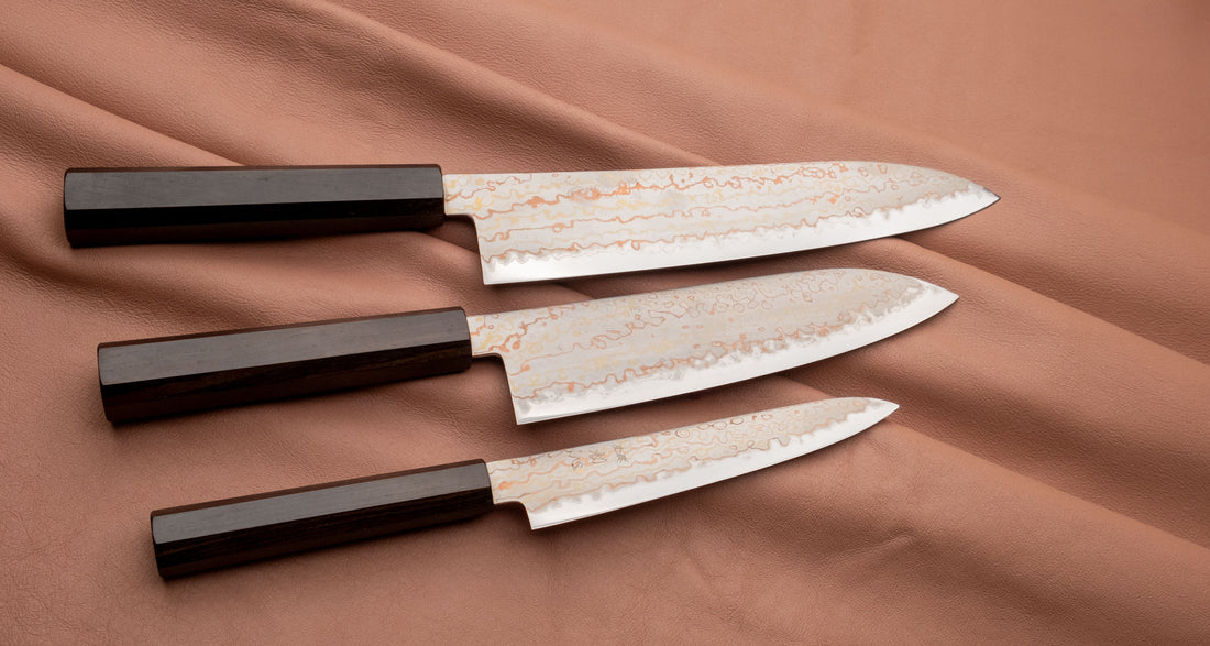 The whole set together with gyuto and santoku. Hayabusa Petty Aogami #2 Rainbow Damascus 150mm is a versatile Japanese kitchen knife ideal for preparing meat, fish, and vegetables. Its blade, made of Aogami #2 steel, is thin and precise. It excels in sharpness, edge retention, and ease of maintenance, but above all looks - with the unique rainbow damascus pattern!