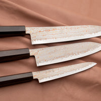 The whole set together with gyuto and santoku. Hayabusa Petty Aogami #2 Rainbow Damascus 150mm is a versatile Japanese kitchen knife ideal for preparing meat, fish, and vegetables. Its blade, made of Aogami #2 steel, is thin and precise. It excels in sharpness, edge retention, and ease of maintenance, but above all looks - with the unique rainbow damascus pattern!