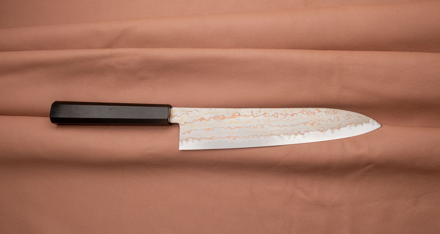 Hayabusa Gyuto Aogami #2 Rainbow Damascus is a versatile Japanese kitchen knife ideal for preparing meat, fish, and vegetables. Its blade, made of Aogami #2 steel, is thin and precise. It xcels in sharpness, edge retention, and ease of maintenance, but above all - looks - with the unique rainbow damascus pattern!