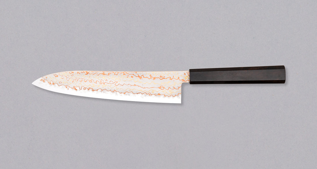 Hayabusa Gyuto Aogami #2 Rainbow Damascus is a versatile Japanese kitchen knife ideal for preparing meat, fish, and vegetables. Its blade, made of Aogami #2 steel, is thin and precise. It xcels in sharpness, edge retention, and ease of maintenance, but above all - looks - with the unique rainbow damascus pattern!
