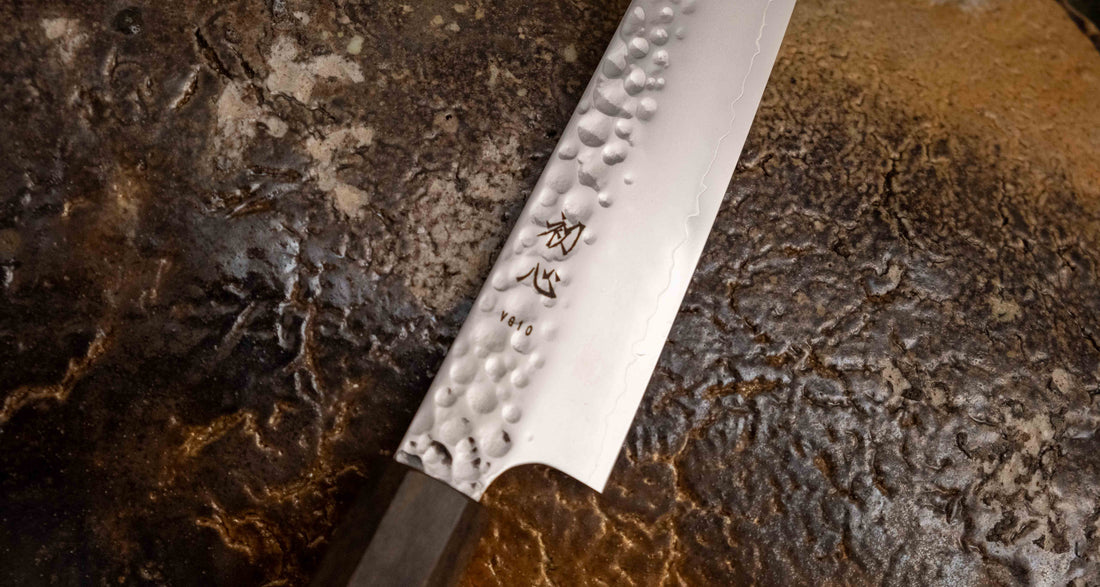 Close-up view of the Hayabusa Petty VG-10 Tsuchime 150 mm blade, showcasing its hammered tsuchime finish and precision craftsmanship.