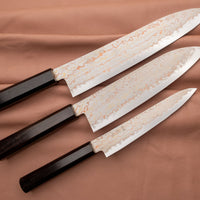Hayabusa Gyuto Aogami #2 Rainbow Damascus is a versatile Japanese kitchen knife ideal for preparing meat, fish, and vegetables. Its blade, made of Aogami #2 steel, is thin and precise. It xcels in sharpness, edge retention, and ease of maintenance, but above all - looks - with the unique rainbow damascus pattern!