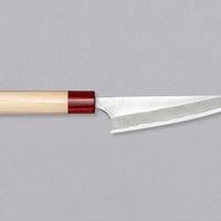 The striking collection by brand Masakage and blacksmith Yoshimi Kato is called Yuki - snow. The subtle whiteness of the blade and magnolia handle are designed to remind of a snowy winter landscape. With a carbon steel core and stainless outer layers, this line represents the perfect blend of beauty and performance.