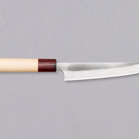 The striking new collection by the brand Masakage and blacksmith Yoshimi Kato is called Yuki - snow. The subtle whiteness of the blade and the light magnolia handle are designed to remind one of a snowy winter landscape. With a carbon steel core and stainless outer layers, this line represents the perfect blend of beauty and performance.