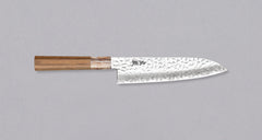 Kotetsu Santoku VG-10 Damascus 180mm (7.08") is a large multi-purpose Janapese knife with visible hammer prints, a damascus pattern, and a classic Japanese (wa-style) teak handle. It will impress anyone who appreciates aesthetically designed kitchen utensils.