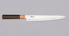 The Kotetsu Sujihiki VG-10 Damascus 240mm (9.5") is a long and narrow Japanese slicer with visible hammer prints, a damascus pattern, and a classic Japanese (wa-style) pakka wood handle. It will impress anyone who appreciates aesthetically designed kitchen utensils.