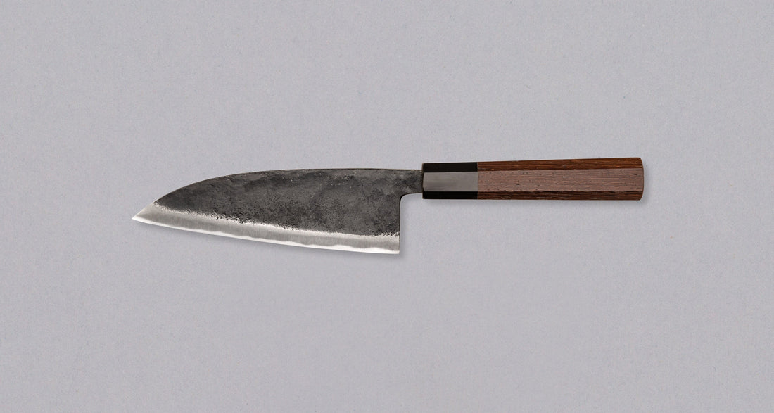 Discover the Kurokaze Ryo-Deba Aogami #2 Kuro-uchi 165mm – a robust, double-bevel deba knife crafted for fish enthusiasts and chefs alike. Unlike traditional single-bevel debas, this Ryo-Deba is easier to sharpen and ideal for tackling tough tasks, from slicing through large fish bones to handling chicken. Designed with a symmetrical blade, it’s perfect for both right- and left-handed users. Built for serious kitchen work, this durable knife is a must-have for professionals and skilled home cooks, especiall