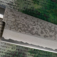 Damascus Santoku Black features a Western-style (Yo) handle from black micarta. This knife will be a great addition to your kitchen, suitable for cutting veggies, meat and fish. Blacksmith Masutani is known as an incredibly good knife sharpener, and his knives are no different, featuring a very thin spine (around 1.8mm).