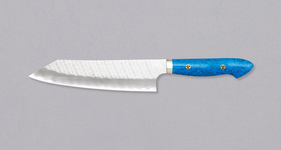 Nigara Kiritsuke-Gyuto SG2 Tsuchime is a multi-purpose Japanese kitchen knife, suitable for preparing meat, fish, and vegetables. Its SG2 powder steel core ensures long-lasting sharpness with little to no maintenance, as the steel resists corrosion very well. Browse our large selection of handcrafted Japanese knives!