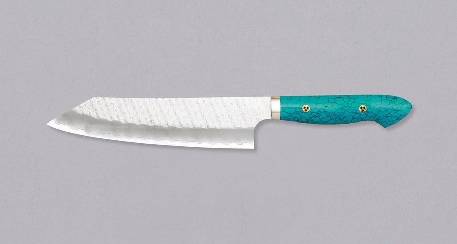 Nigara Kiritsuke-Gyuto SG2 Tsuchime is a multi-purpose Japanese kitchen knife, suitable for preparing meat, fish, and vegetables. Its SG2 powder steel core ensures long-lasting sharpness with little to no maintenance, as the steel resists corrosion very well. Browse our large selection of handcrafted Japanese knives!