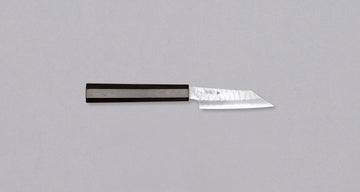 Nigara Kiri-Petty SG2 Migaki Tsuchime Wa Ebony is a small Japanese kitchen knife, intended for all those smaller tasks where larger and wider knives are deemed unwieldy. Its core is made of SG2 powder steel, ensuring long-lasting sharpness while requiring minimal maintenance. Fitted with a luxurious dark ebony handle.