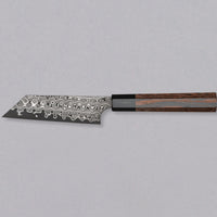 Nigara Kiritsuke Petty SG2 Damascus 120mm is a Japanese kitchen knife suitable for smaller cutting tasks. It's adorned with a raindrop damascus pattern and fitted with a wenge wood handle. Its SG2 powder steel core ensures long-lasting sharpness with little to no maintenance, as the steel resists corrosion very well.