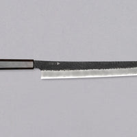 Nigara Sakimaru Sujihiki SG2 Kurouchi Tsuchime 270mm (10.6") [Ebony] is a traditional Japanese knife used for preparing meat and raw fish. It slices protein in one pulling motion, creating smooth, shiny cuts. Its SG2 powder steel core ensures long-lasting sharpness with little to no maintenance. A beast of a knife!