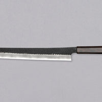 Nigara Sakimaru Sujihiki SG2 Kurouchi Tsuchime 270mm (10.6") [Ebony] is a traditional Japanese knife used for preparing meat and raw fish. It slices protein in one pulling motion, creating smooth, shiny cuts. Its SG2 powder steel core ensures long-lasting sharpness with little to no maintenance. A beast of a knife!