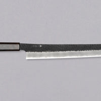Nigara Sakimaru Sujihiki SG2 Kurouchi Tsuchime 300mm (11.8") [Ebony] is a traditional Japanese knife used for preparing meat and raw fish. It slices protein in one single pulling motion, creating smooth, shiny cuts. Its SG2 powder steel core ensures long-lasting sharpness with little to no maintenance.