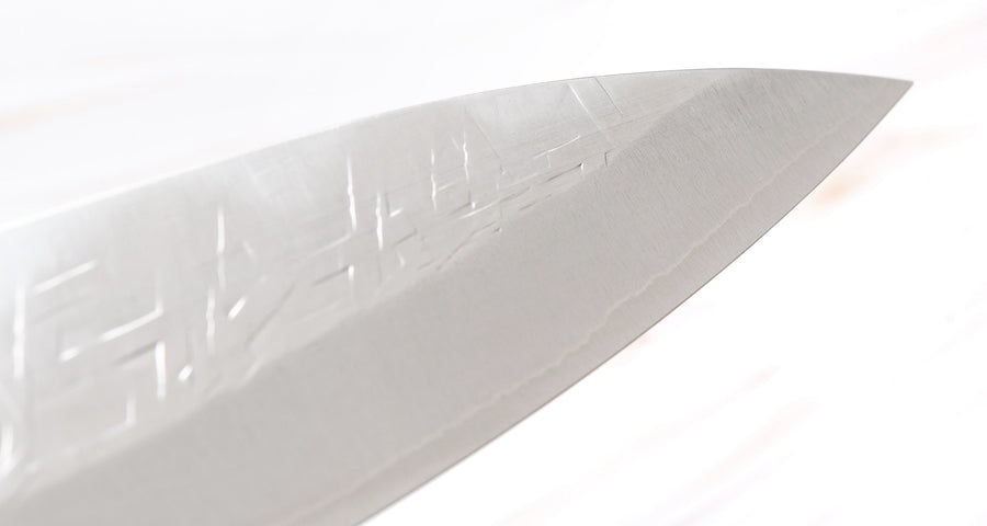 KNife tip. Saji Gyuto SRS13 Tsuchime 240mm (9.4") is a multi-purpose Japanese kitchen knife, suitable for preparing meat, fish, and vegetables. It’s a truly out-of-this-world piece of knifemaking. Its heart was forged out of SRS13, a high-speed powder steel, renowned for its high hardness and excellent corrosion resistance.