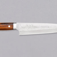 Saji Gyuto SRS13 Tsuchime 240mm (9.4") is a multi-purpose Japanese kitchen knife, suitable for preparing meat, fish, and vegetables. It’s a truly out-of-this-world piece of knifemaking. Its heart was forged out of SRS13, a high-speed powder steel, renowned for its high hardness and excellent corrosion resistance.
