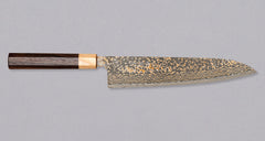 The Saji Gyuto VG-10 Gold RWO 240mm is a high-quality, multi-purpose Japanese knife crafted by Takeshi Saji of Takefu Knife Village. It has a special lamination process where brass is added to the outer layers to achieve a gold-colored damascus pattern. It's made from stainless VG-10 steel and has a rosewood wa handle.