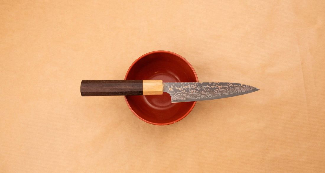 The Saji Petty VG-10 Gold RWO 135 mm is a small Japanese kitchen knife suitable for preparing meat, fish and vegetables. However, it would be an injustice to call it just a kitchen knife, as it is a remarkable example of blacksmith's craftsmanship - from its unique design to its very specific features.