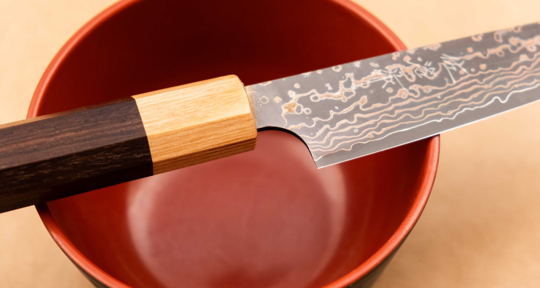 The Saji Petty VG-10 Gold RWO 135 mm is a small Japanese kitchen knife suitable for preparing meat, fish and vegetables. However, it would be an injustice to call it just a kitchen knife, as it is a remarkable example of blacksmith's craftsmanship - from its unique design to its very specific features.