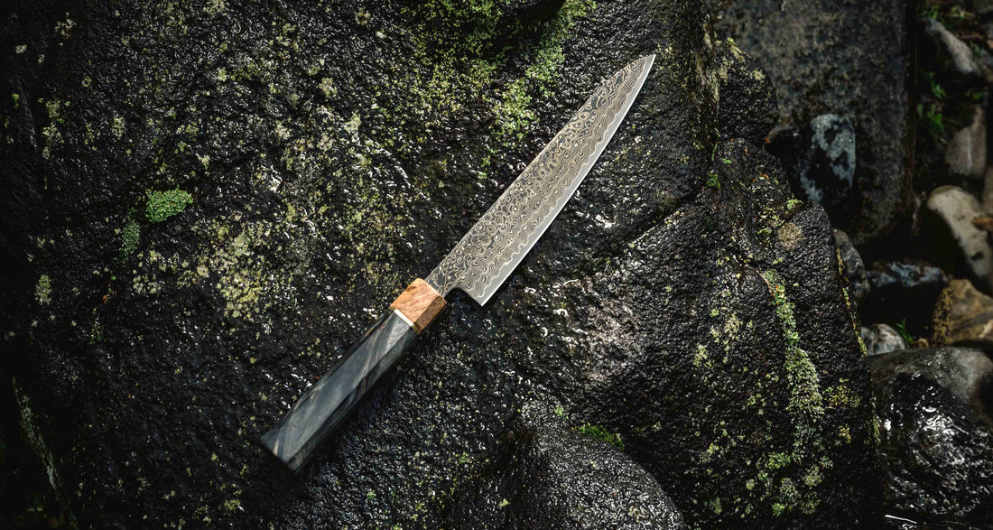 The Senzo Dawn Limited Edition Petty SG2 150mm (5.9") is a small multi-purpose Japanese knife, hand-made in the Japanese smithy Suncraft. It's a stunning collector's item. The knife is fitted with a traditional Japanese octagonal handle topped with a special ferrule made from the wood of a 300-year-old holy oak tree.