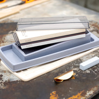 Professional quality sharpening stones for your home kitchen that quickly form a paste during sharpening, ensuring even and fast results. The set includes a combination whetstone (#1000 and #3000 grit), a sharpening pad, and a stone base that doubles as a stand and water collector. Suitable for all types of steel.