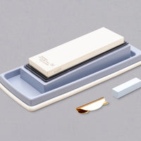 Professional quality sharpening stones for your home kitchen that quickly form a paste during sharpening, ensuring even and fast results. The set includes a combination whetstone (#1000 and #3000 grit), a sharpening pad, and a stone base that doubles as a stand and water collector. Suitable for all types of steel.