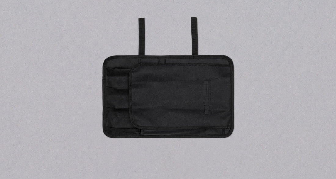 Our SharpEdge Black Chef's Knife Roll is best suited for chefs on-the-go and home cooks who need a small knife roll that can still hold very long knives (up to 440mm (17.3")). It has 4 pockets for knives and utensils, and additional velcro fasteners to keep them in place. A minimalistic, durable black knife bag.