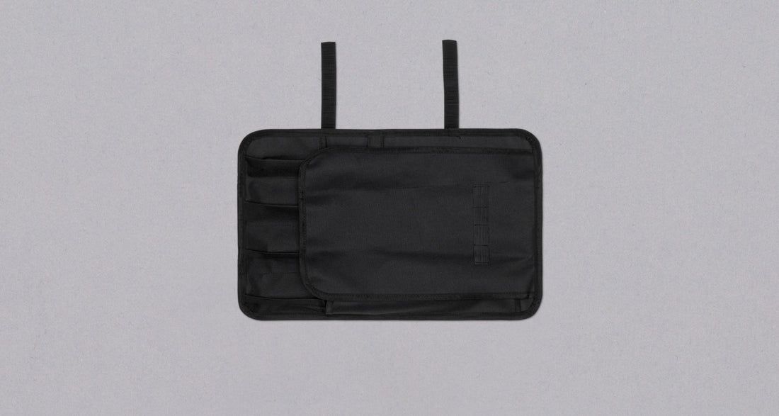 Our SharpEdge Black Chef's Knife Roll is best suited for chefs on-the-go and home cooks who need a small knife roll that can still hold very long knives (up to 440mm (17.3")). It has 4 pockets for knives and utensils, and additional velcro fasteners to keep them in place. A minimalistic, durable black knife bag.