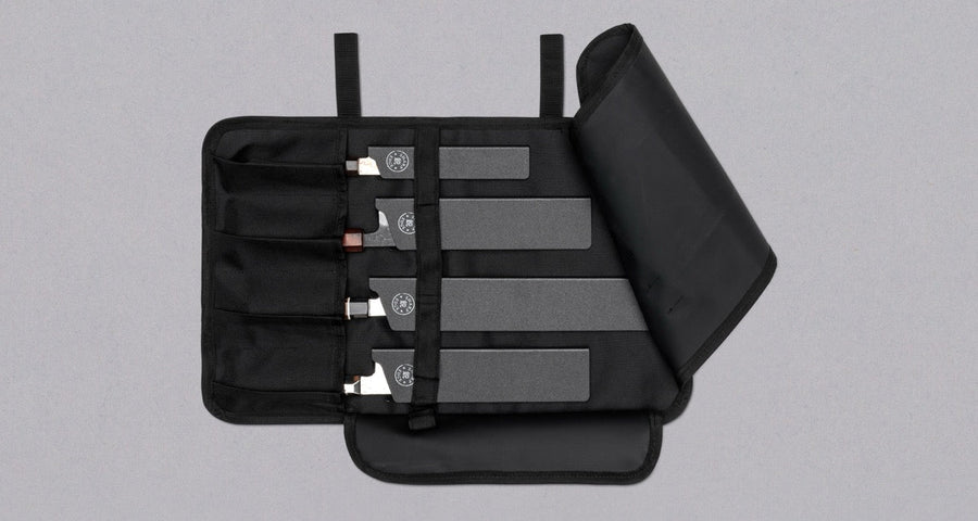 Our SharpEdge Black Chef's Knife Roll is best suited for chefs on-the-go and home cooks who need a small knife roll that can still hold very long knives (up to 440mm (17.3")). It has 4 pockets for knives and utensils, and additional velcro fasteners to keep them in place. A minimalistic, durable black knife bag.