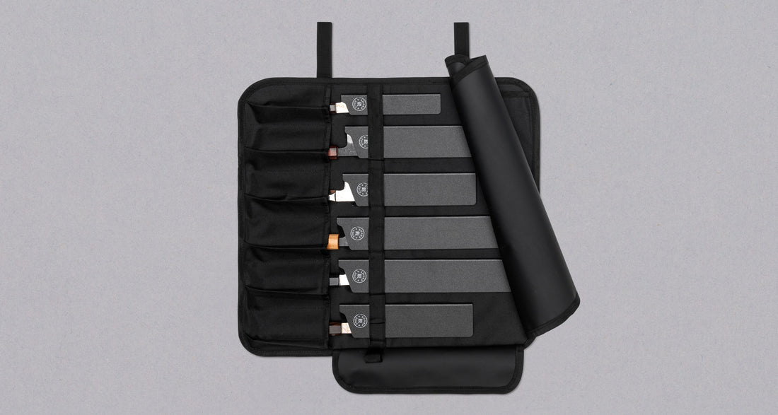 Our SharpEdge Black Chef's Knife Roll is best suited for chefs on-the-go and home cooks who need a sturdy knife roll that can hold very long knives (up to 440mm (17.3")). It has 6 pockets for knives and utensils, and additional velcro fasteners to keep them in place. A minimalistic, durable black knife bag. Get yours.