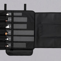 Our SharpEdge Black Chef's Knife Roll is best suited for chefs on-the-go and home cooks who need a sturdy knife roll that can hold very long knives (up to 440mm (17.3")). It has 6 pockets for knives and utensils, and additional velcro fasteners to keep them in place. A minimalistic, durable black knife bag. Get yours.