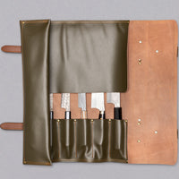 Chefs Leather Knife Roll is a must for every professional chef or passionate home cook with a large arsenal of kitchen tools. An elegant and safe way to store and transport your knives and kitchen accessories wherever the job takes you. This Chefs Leather Knife Roll is made of dark green suede leather, holds 6 knives.