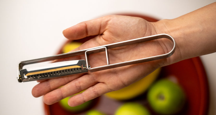 This medium version of the Julienne peeler, SSK-13, from Japanese manufacturer Suncraft is made of very sharp, precise, and thin stainless steel.  A Julienne peeler is a quick and safe tool for making thin julienne strips of vegetables, especially harder veggies like carrots, zucchini, potatoes, sweet potatoes, etc. Great for making garnishes, salad toppings, stir-fries, potato hash browns, citrus zest, and more.  Total length: 190mm (7.5")